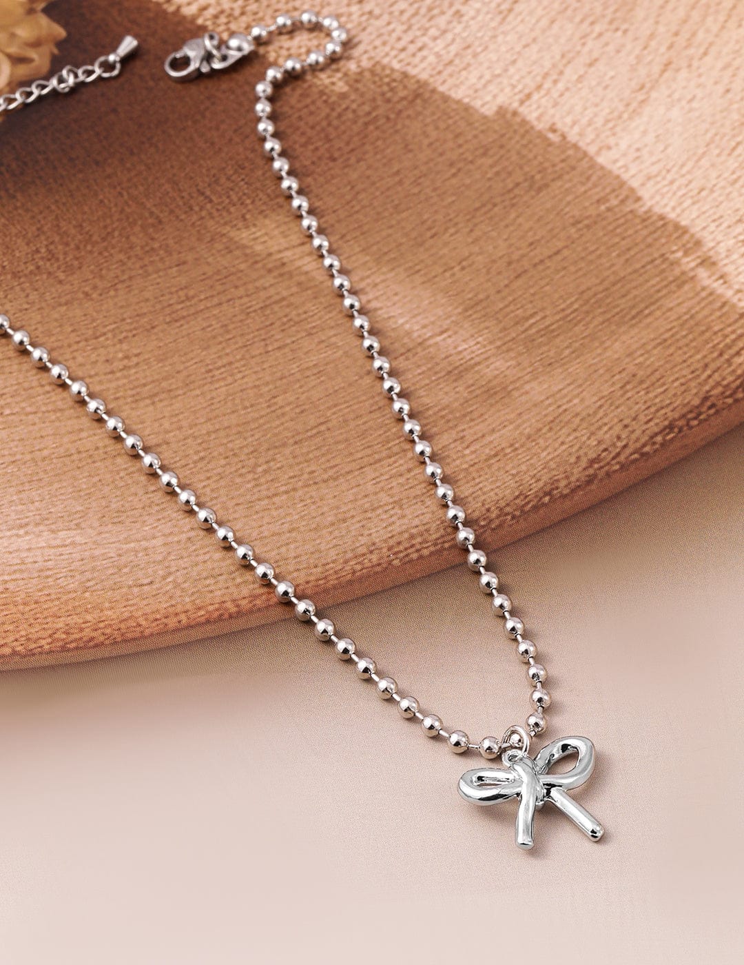 rhodium-plated-silver-beaded-chain-necklace-with-minimalist-bow-pendant-neckl